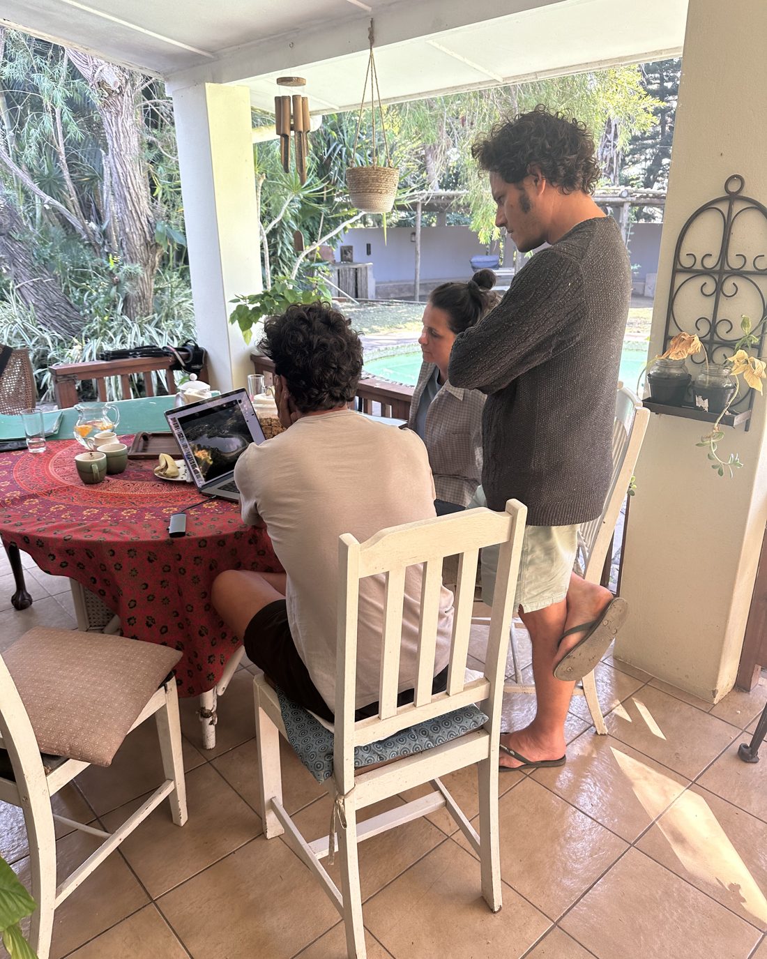 Gonzalo and Shaan reviewing a land plan on-site with a client